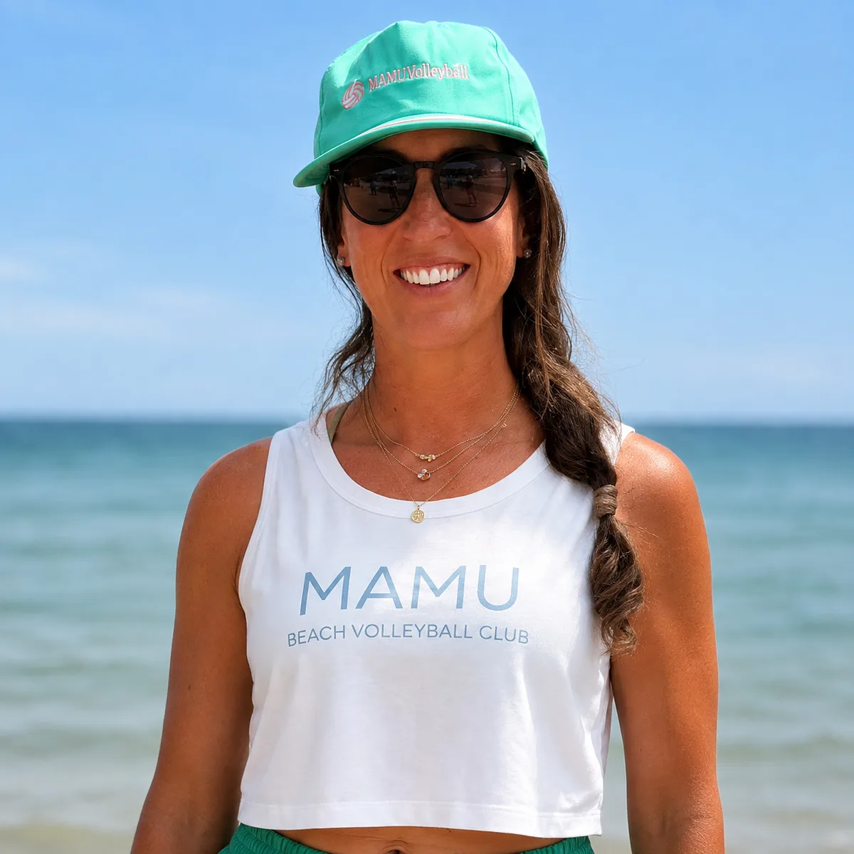 Julie Doan Kurenuma, co-director of Mamu Beach Volleyball Club, in club kit on the beach