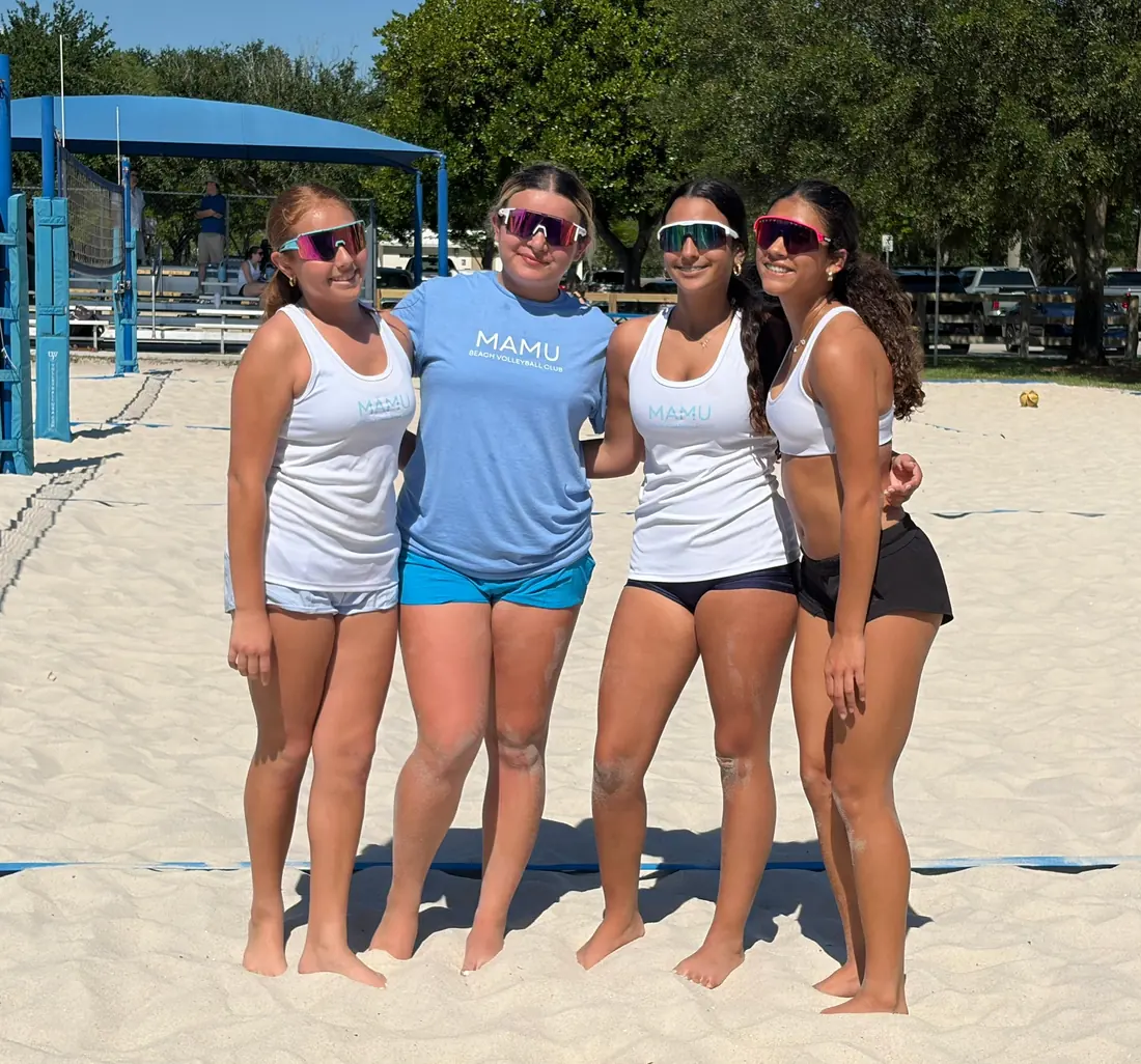 Mamu Beach athletes together at the net