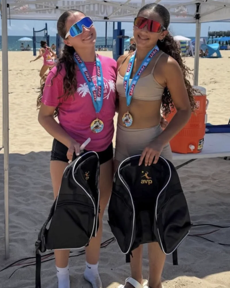 Isa Sotolongo and Sophia Broche with their Florida Beach Volleyball Tour gold medals