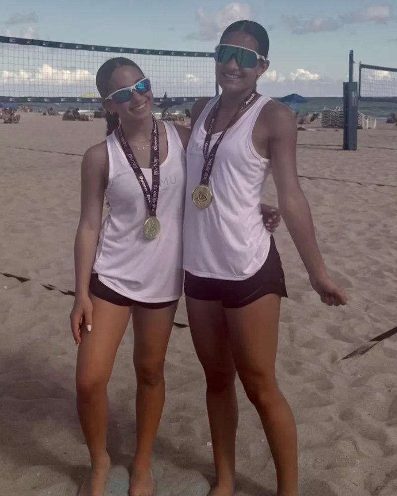Tory Young and Anabelle Bencosme with their BVNE Florida Beach Volleyball Tour gold medals