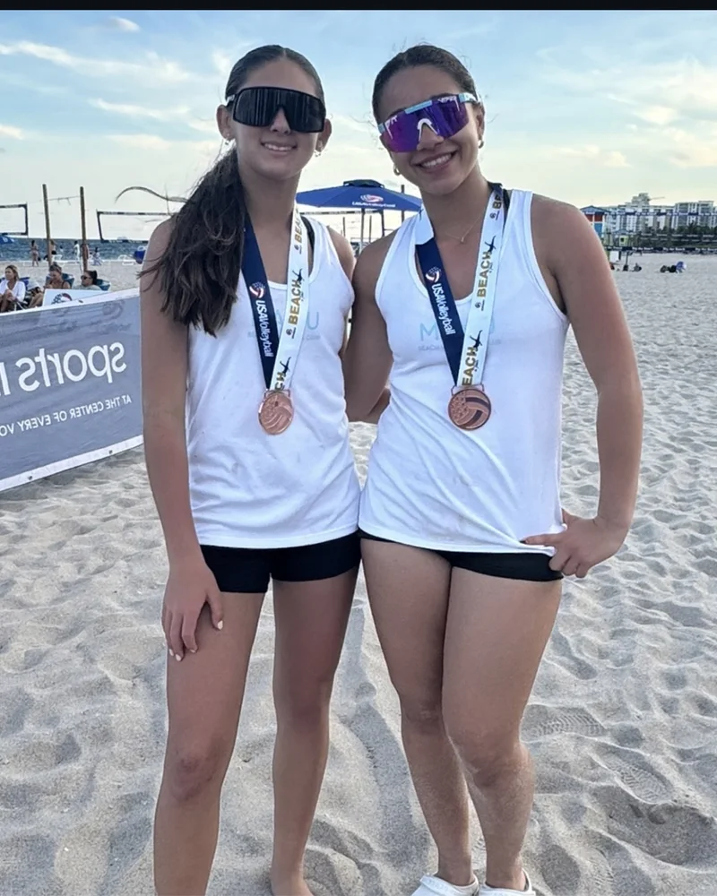 Bella Fernandez and Hailey Pena with their USA Volleyball Beach National Qualifier medals