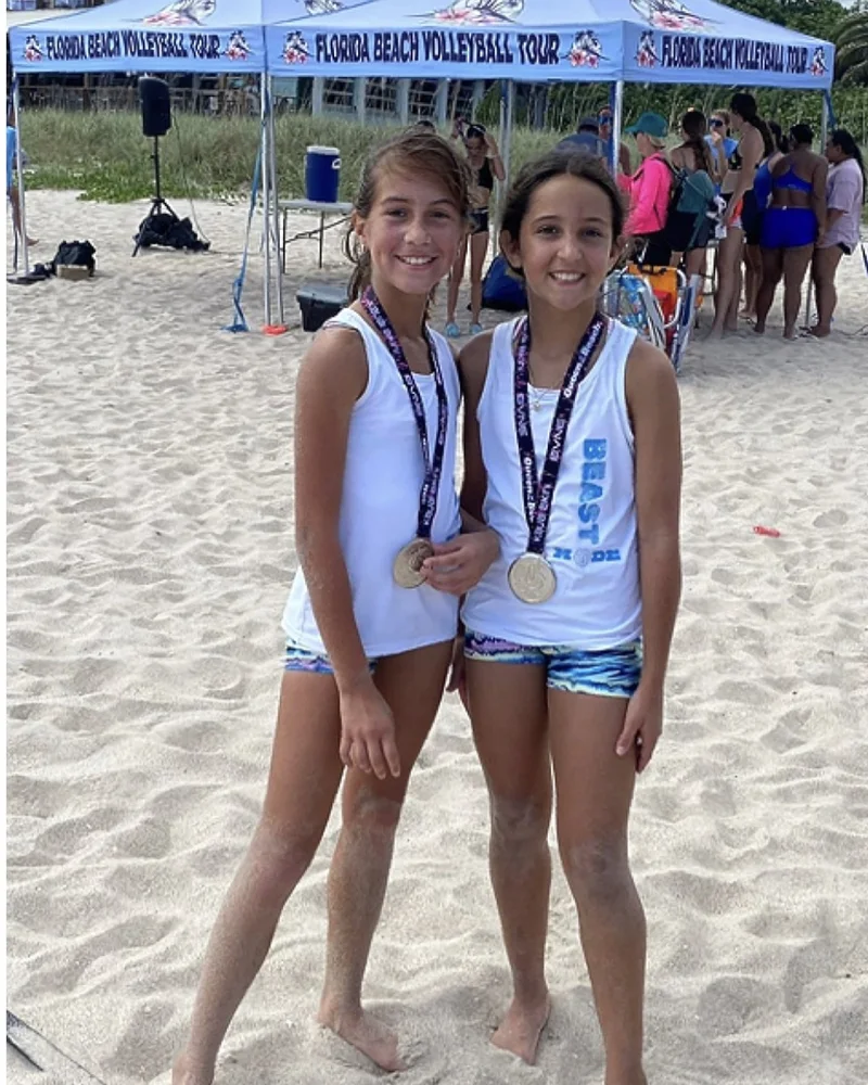 Izzy Martinez and Sofia Lorenzo with their BVNE Florida Beach Volleyball Tour silver medals