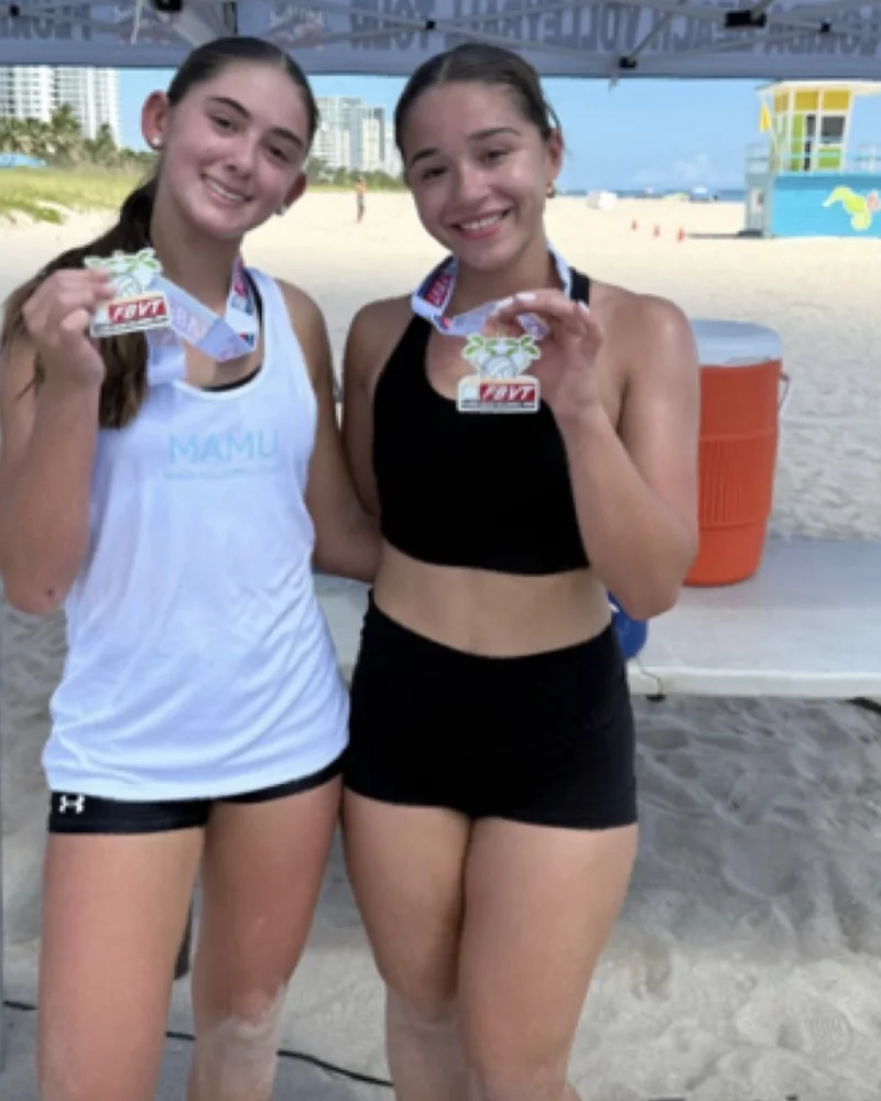 Bella Fernandez and Hailey Pena with their Florida Beach Volleyball Tour gold medals