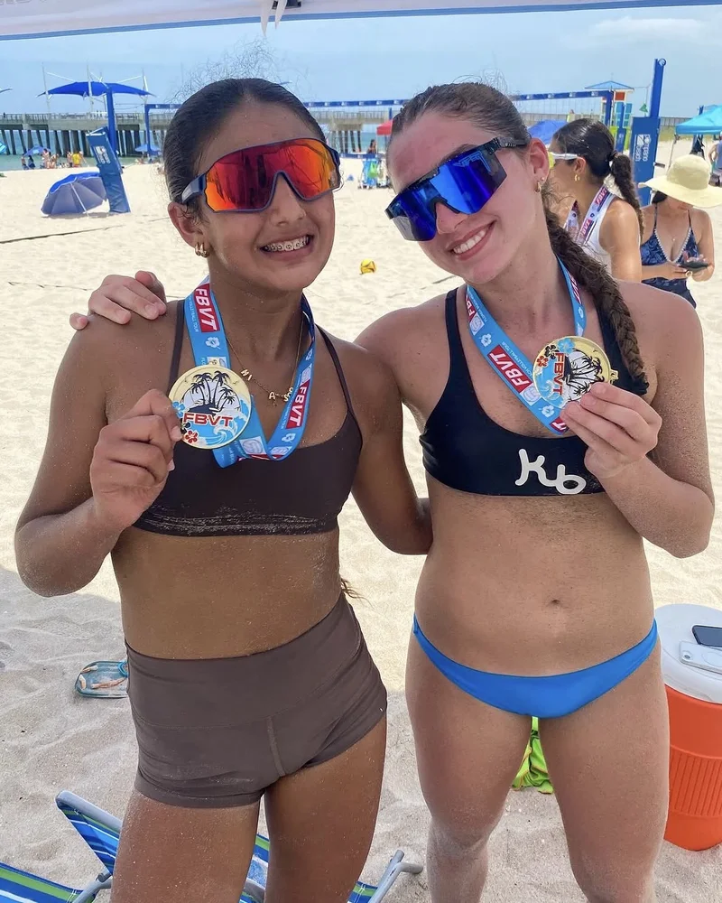 Sophia Broche and Isa Sotolongo with their Florida Beach Volleyball Tour gold medals