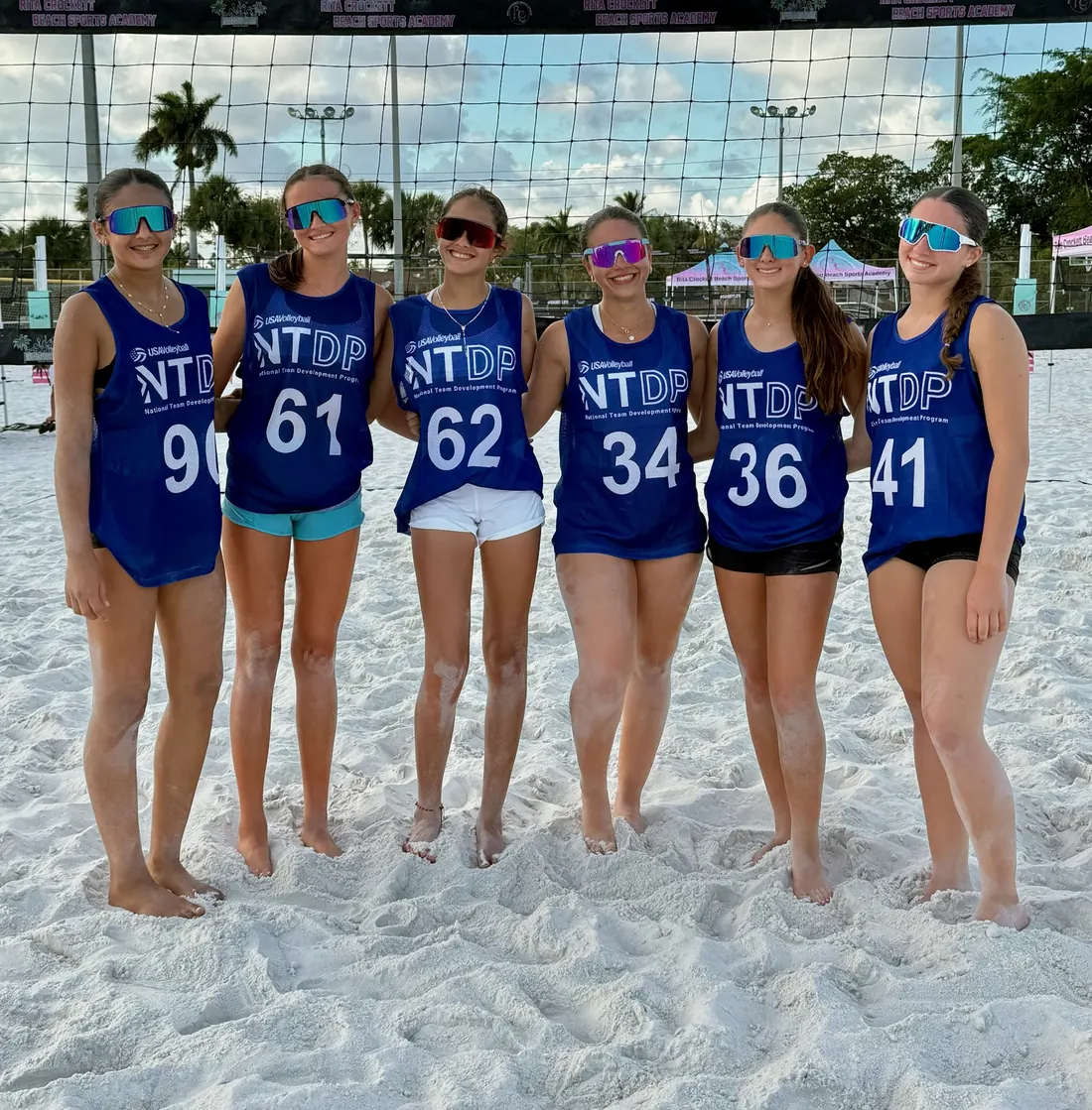 A Mamu Beach national-team group in kit at the net